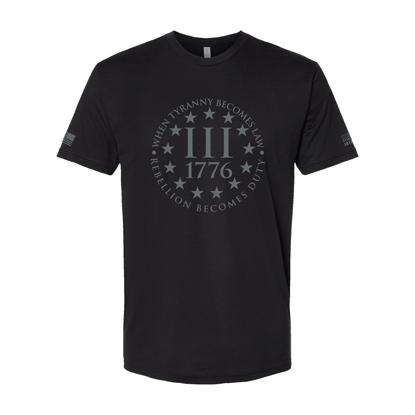 Black unisex t-shirt with "When Tyranny Becomes Law Rebellion Becomes Duty 1776 III" circular design on front and American flag prints on sleeves