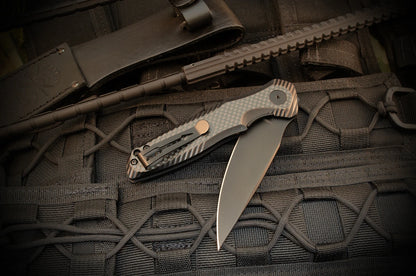 Spartan Blades POROS folding knife clip-side lifestyle view with 154CM blade and carbon fiber G-10 handle